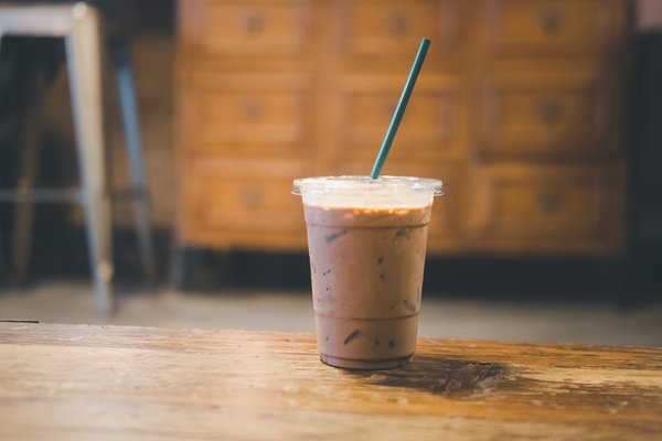 Iced coffee on wooden table.